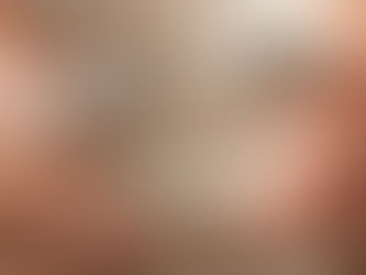 Close-up of a handcrafted silver hinged bracelet clasp held in hands in natural light