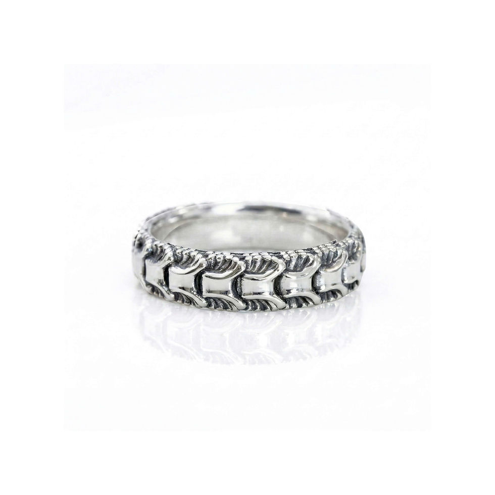 Anemone sterling silver band ring with sculpted texture, photographed on a white background