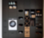 Modern grey Schuller utility room with washing machine.