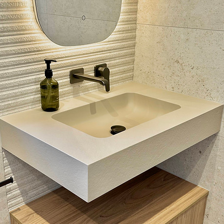 Close-up of Fiora console unit with integrated basin and sleek brassware