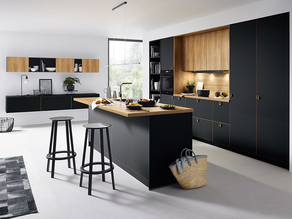 Black kitchen cabinets with wood worktop and backsplash