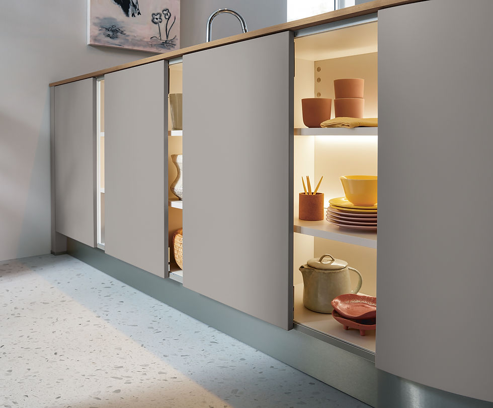 Schuller kitchen handleless cabinets with in cabinet lighting.