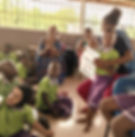 Eye-level view of a lively classroom filled with engaged children and a teacher