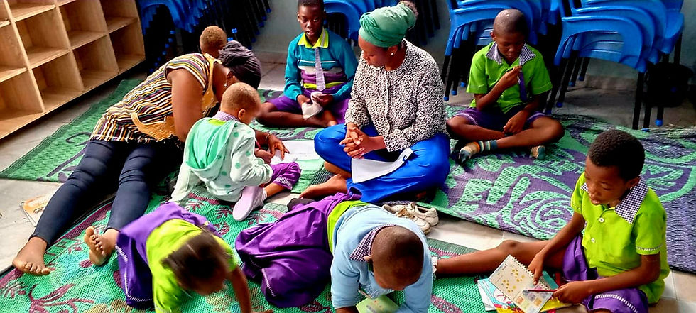 Eye-level view of a rural classroom in northern Ghana with educational materials on the walls