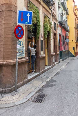 Person reaching for shutters
