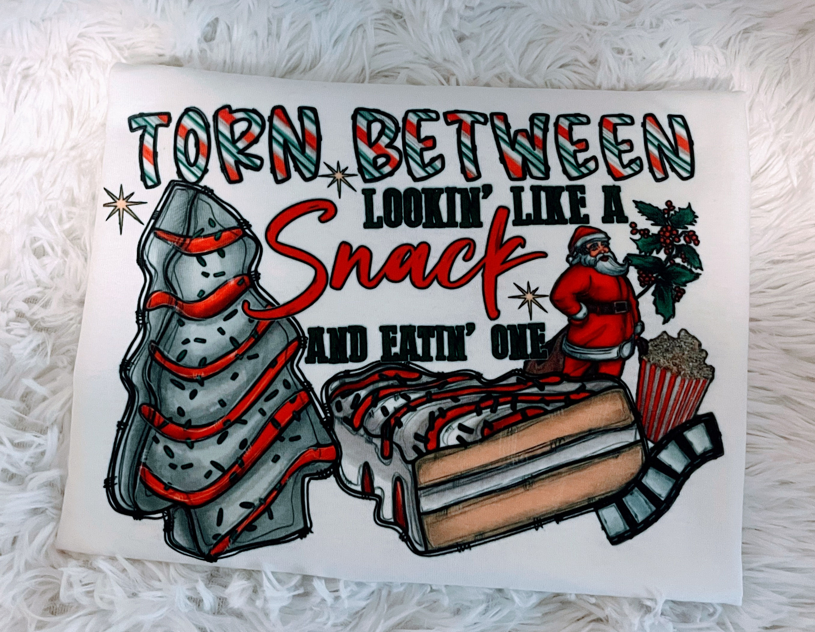 Torn between eating a snack and looking like one Tshirt