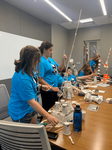 During their visit to the Innovation District, CASE Students build structures at the Unmanned Systems Research Institute in the OSU DISCOVERY building. Students competed to see who could build the tallest and most stable structure to withstand ping pong balls being thrown at them.