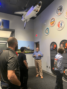 Oklahoma History Museum Director Dan Provo gives the CASE students a tour of the Launch to Landing: Oklahomans and Space exhibit.