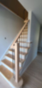 modern metal and wood rail with modern posts and rail profile and sleek black iron balusters