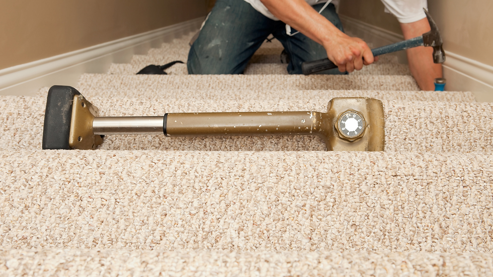 man repairing steps, taking carpet off first