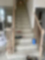 before: old carpeted stairs and railings