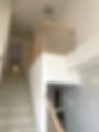 before: old carpeted stairs and railings