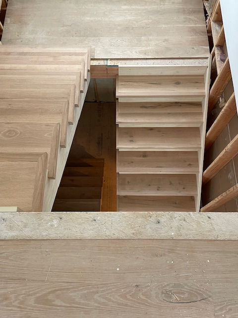 Custom indoor stairs with square nosing designed and installed by Pinto Carpentry of Plainfield NJ