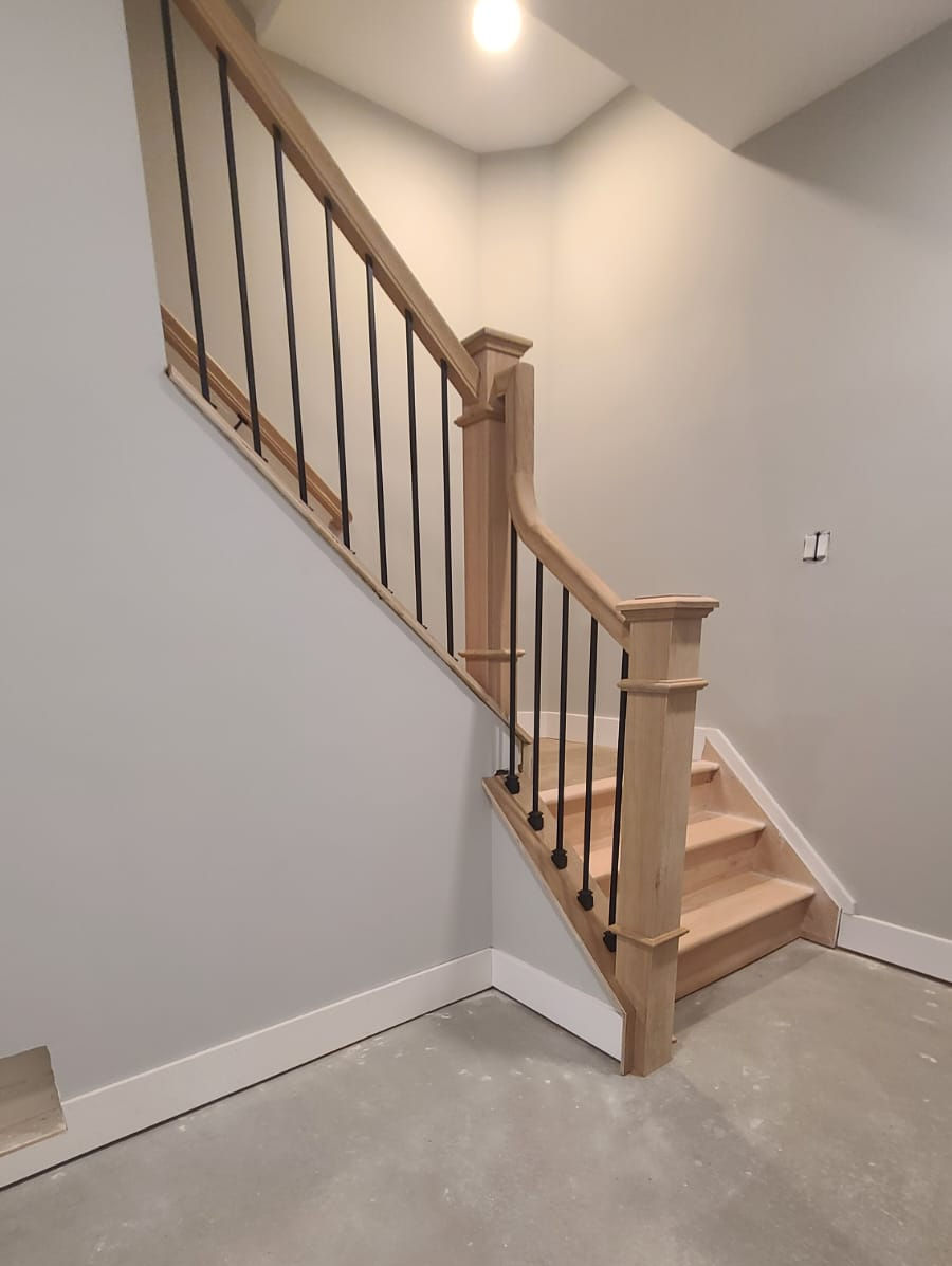 basement stairs with metal and wood
