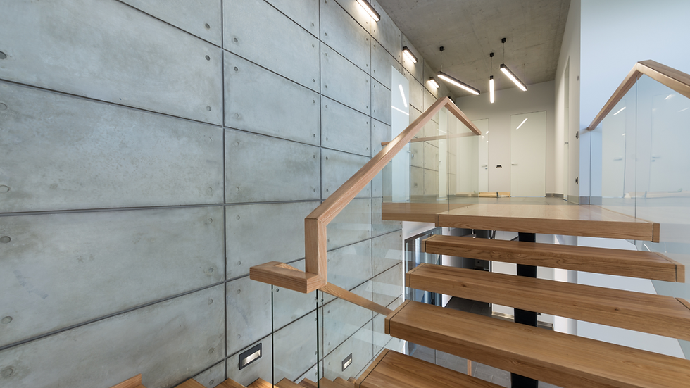 closeup of a modern wood floating staircase with glass railings super modern and sleek