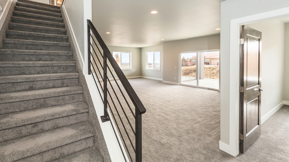 entryway showcasing stairs to the left with black metal horizontal railings