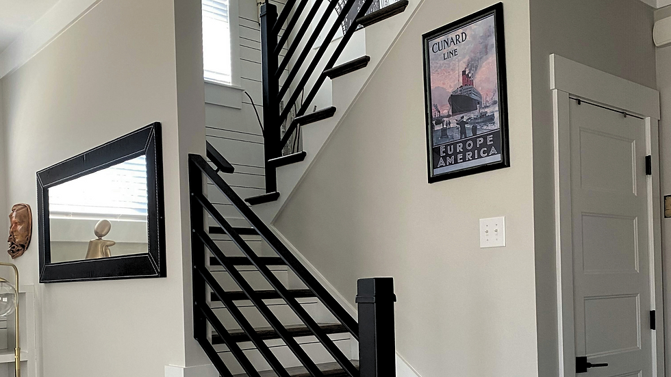 a metal and wood railing, all black sleek and modern