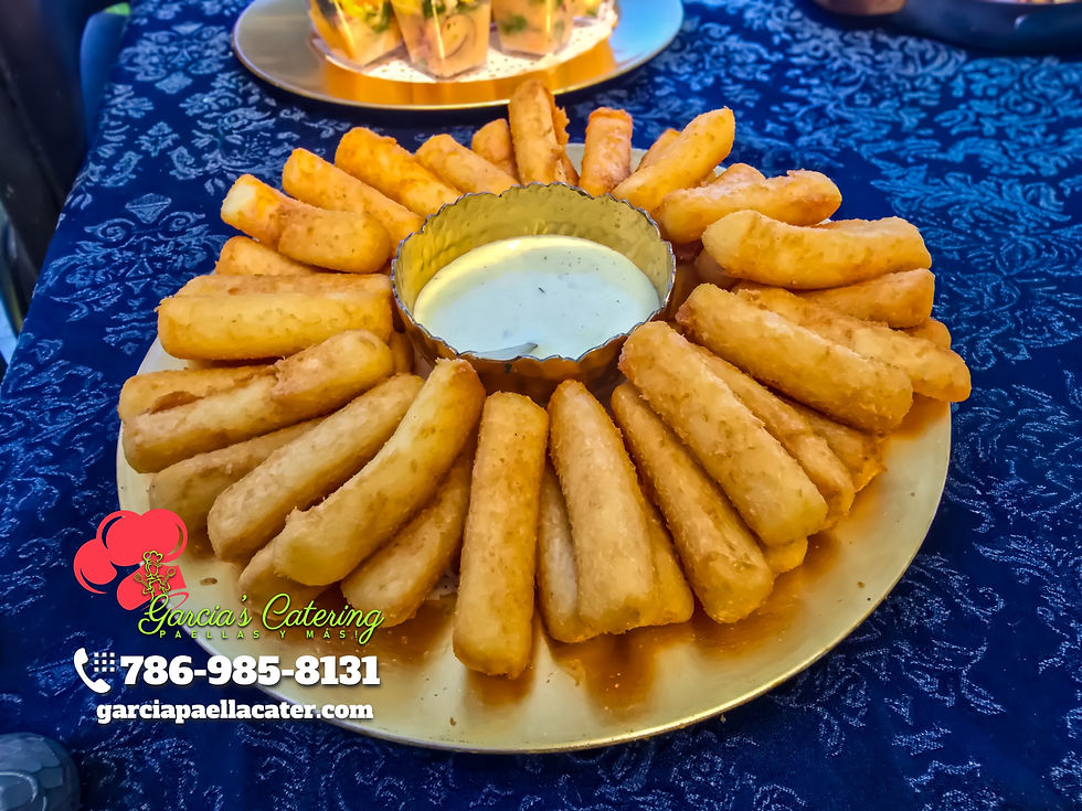 Yuca frita served with garlic sauce.