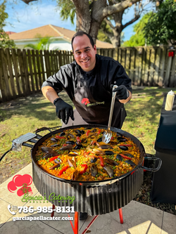 Garcia cooking a small Marinera paella.