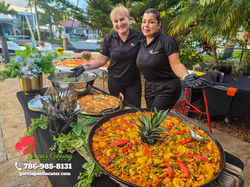 Our chef assistants serving buffet style at a birthday party.