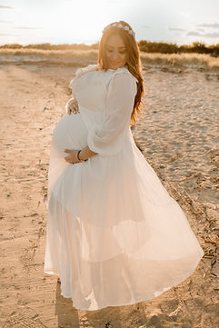 Pregnant woman sunset