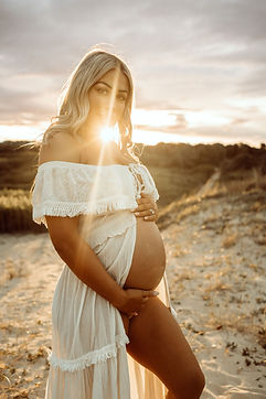 Pregnant woman sunset