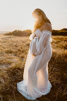 Pregnant woman sunset