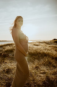 Pregnant woman sunset