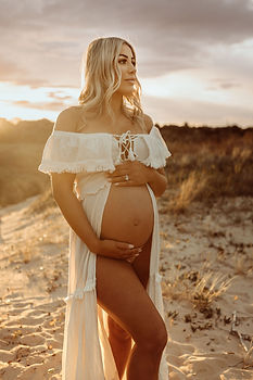 Pregnant woman sunset