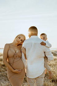 Pregnant woman sunset with family