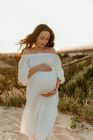 Pregnant woman sunset