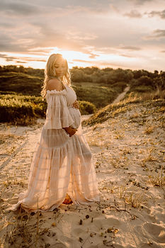 Pregnant woman sunset