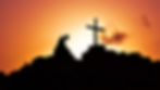 Soldier kneeling at cross