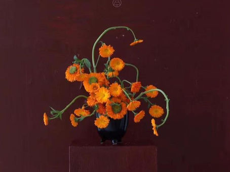 Sculptural flower arrangement of marigolds