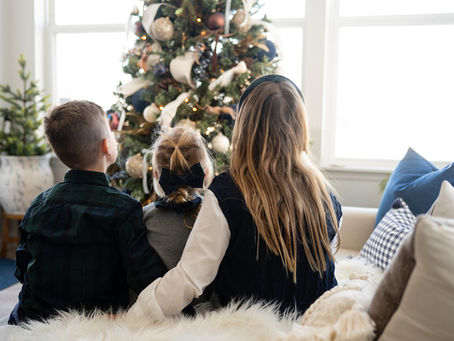 Elegant Christmas tree decorated in soft metallics and neutral tones with velvet ribbon and twinkle lights — designed by EH Design.