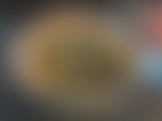 Italian wedding meatball soup; close up shot of spoon in soup