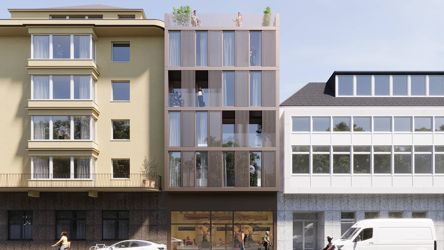 Ansicht Stadthaus mit vielen Fenstern, Dachterrasse und Ladenschgeschäft