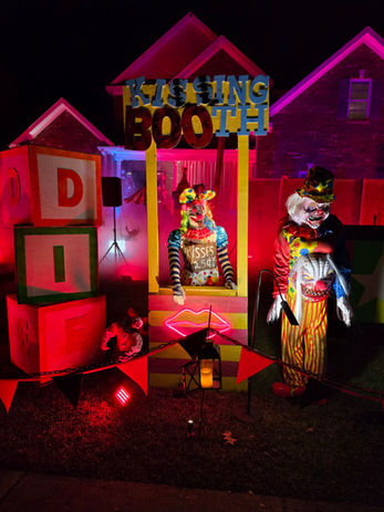 Kissing booth clown in yard display in Greenville, NC
