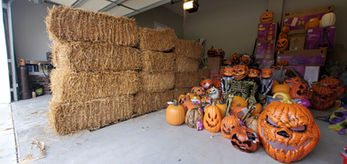 Hay bales and pumpkins fill the garage at the Haunted Halloween House in Greenville