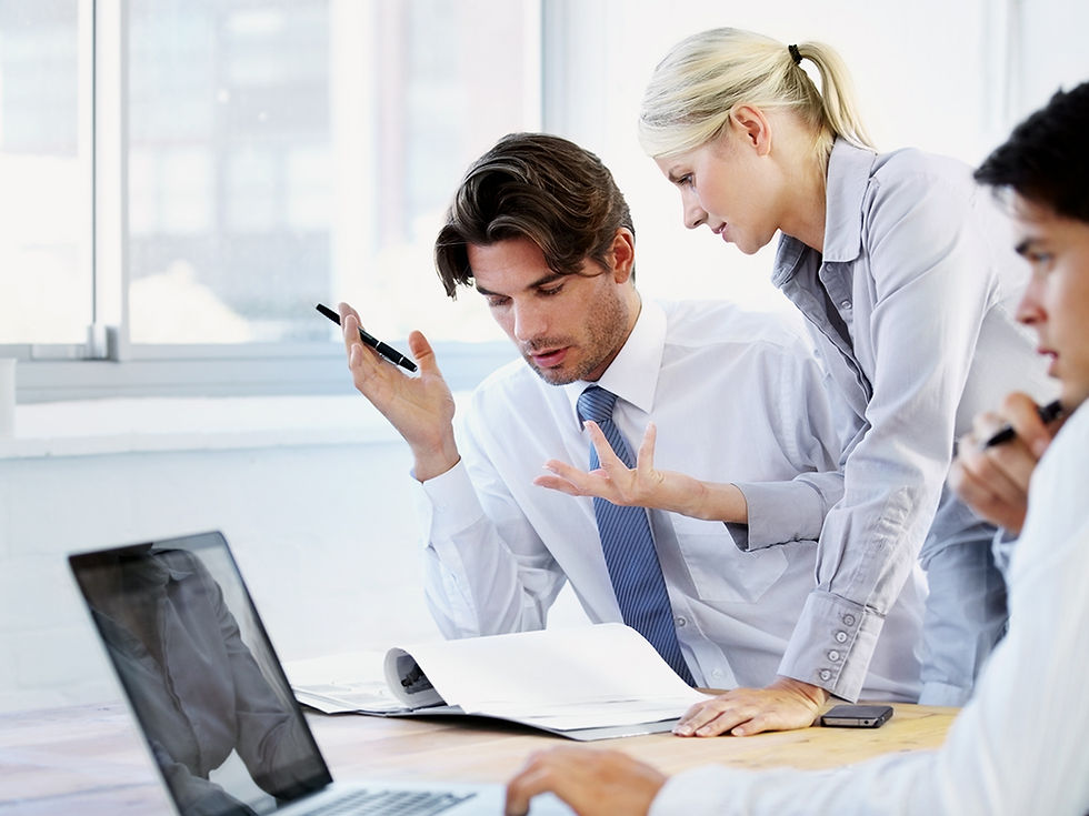 Manager and employees working through team communication issues in a meeting