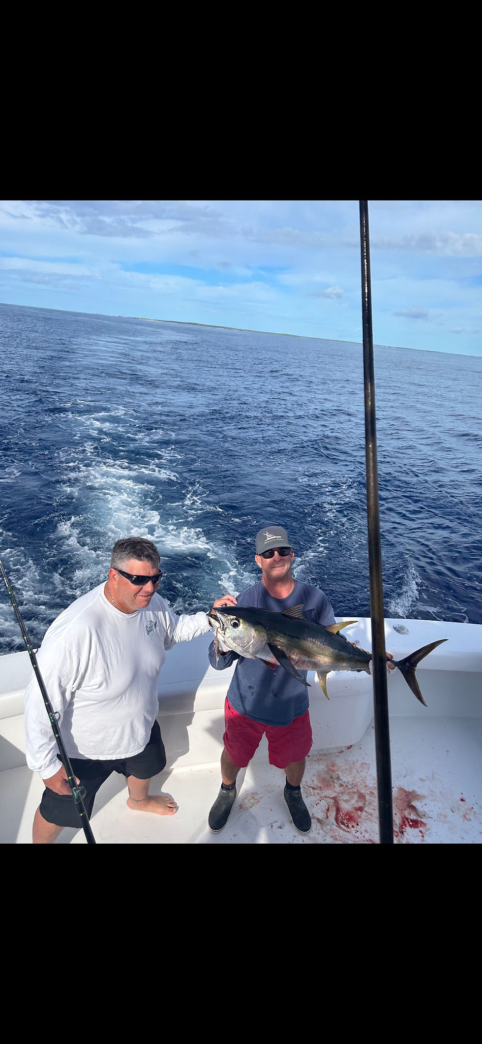 charter guest holding a fish