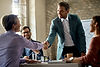 business-coworkers-shaking-hands-meeting-office-focus-is-businessman.jpg