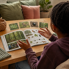 Young person engaged with personalised reading and literacy resources during a learning activity.
