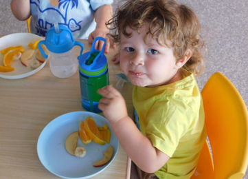Toddler at lunch time at Kidzspot Dilga in Erskine Park.