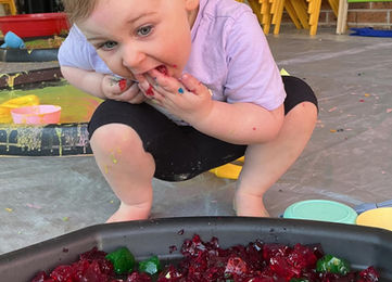 Toddler playing with arts at Kidzspot Dilga in Erskine Park.