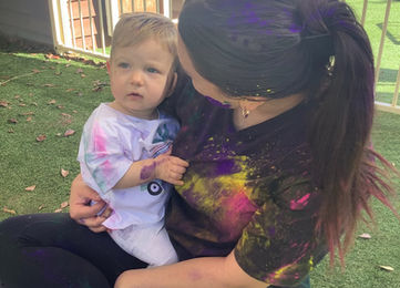 Educator holding a baby at Kidzspot Dilga.