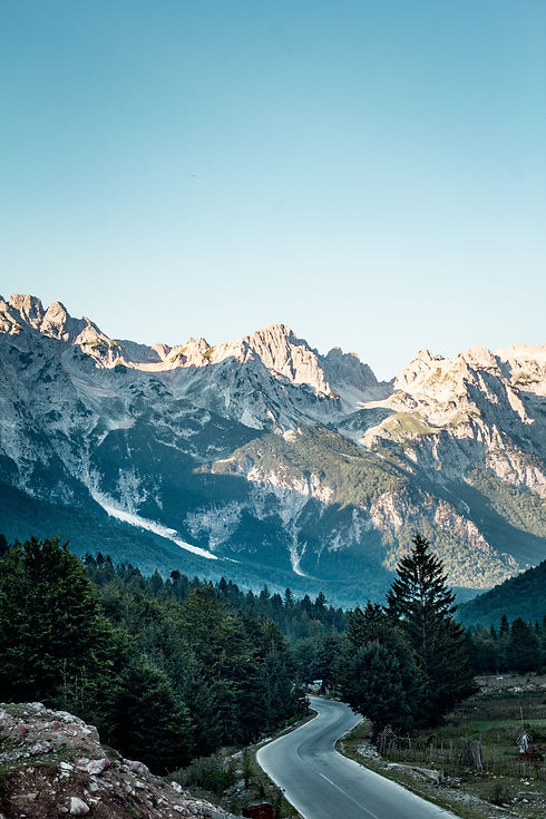 vertical-high-angle-shot-valbona-valley-national-park-clear-blue-sky-albania.jpg