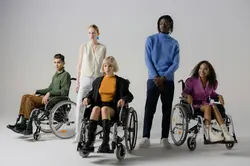 Sitting on wheel chair-group