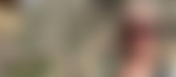 Jules, intimacy and relationship coach, smiling while traveling in Peru during a sabbatical.