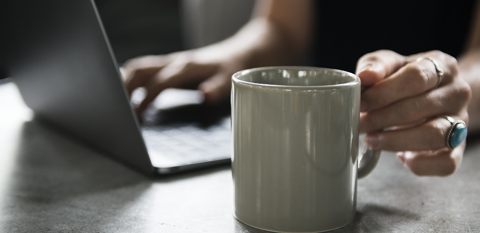 Beverage Mug and a Laptop